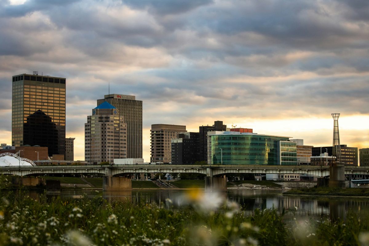 A photo of the Dayton skyline at sunset. Photo by Michael Bowman (bowmanc on unsplash)