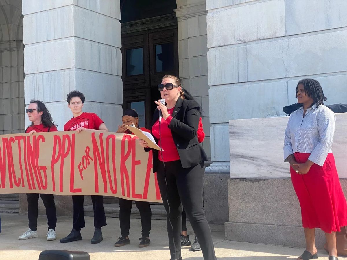 Reclaim members rally for tenants' rights at RI State House