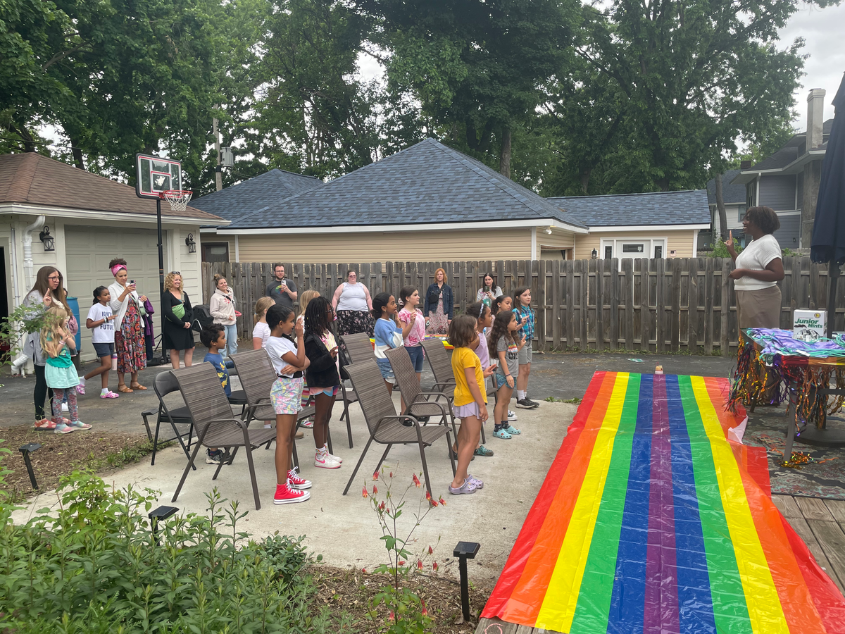Leading our Girl Scouts troop through their bridging ceremony.