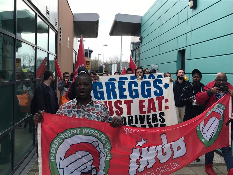 Striking JustEat couriers demonstrate outside Greggs HQ over pay cuts