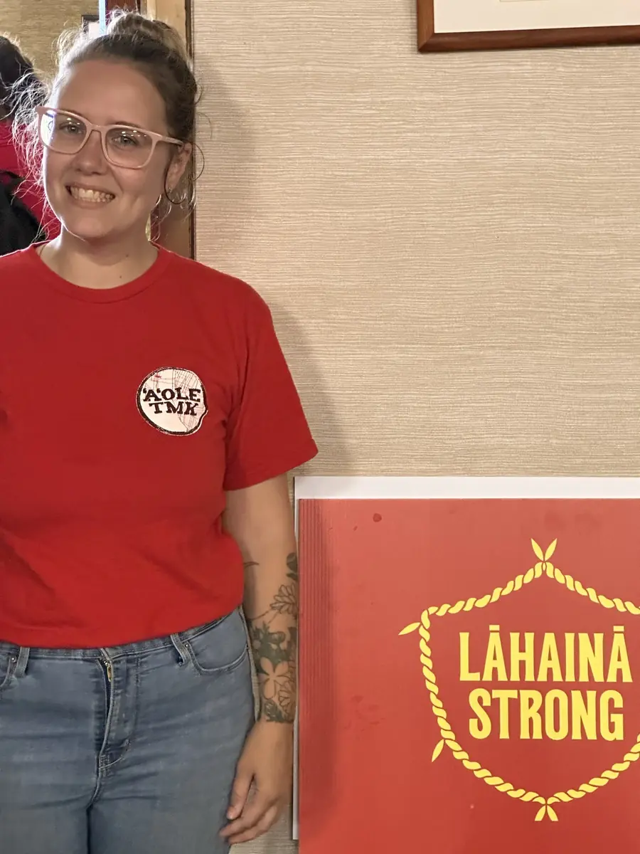 A smiling organizer in a Lāhainā Strong shirt